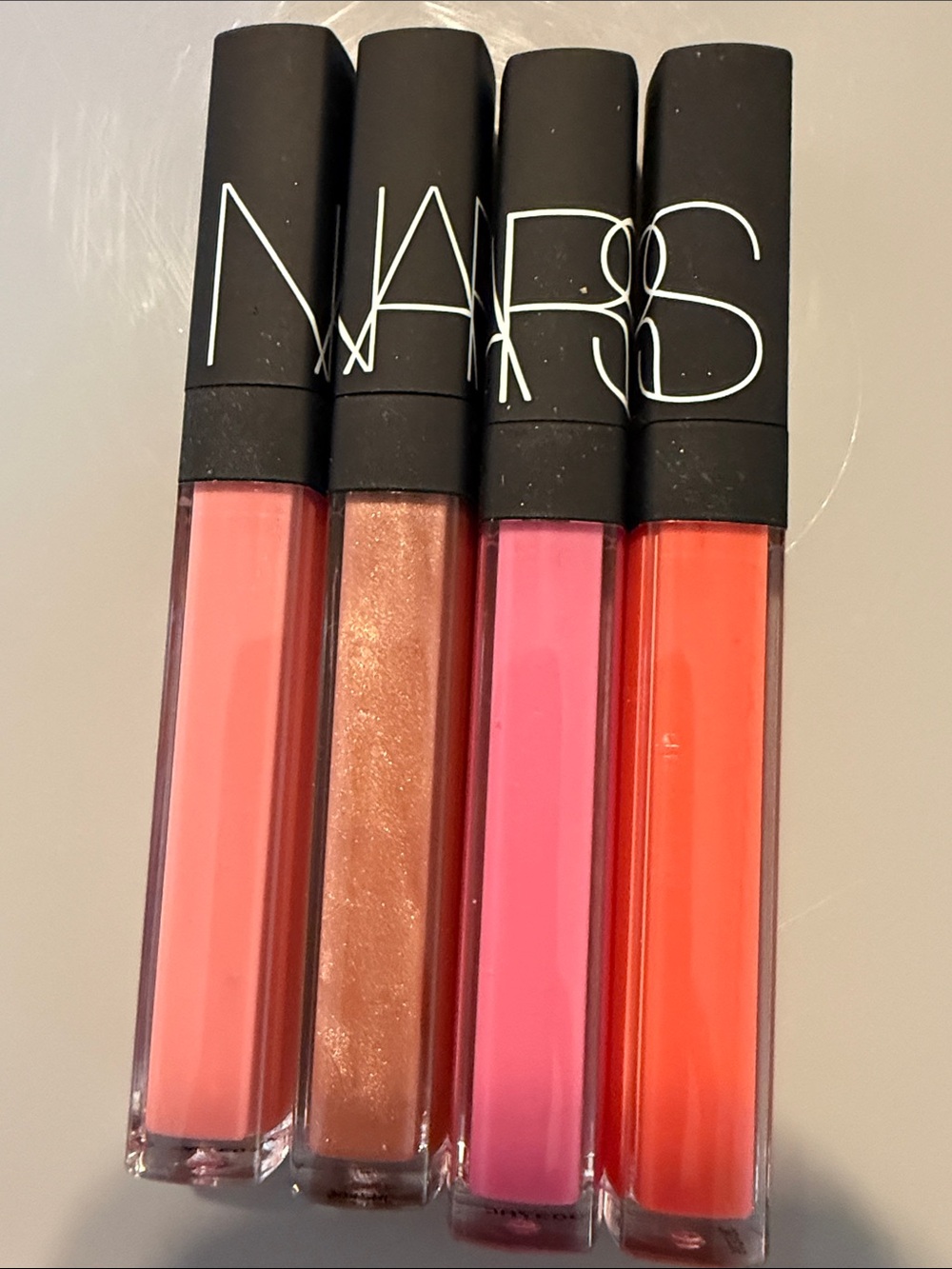 NARS Lip Gloss Set — Peach, Bronze, Pink & Coral Shades